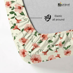 Floral-patterned elastic fitted bedsheet with 'aurave' branding and text on a light background