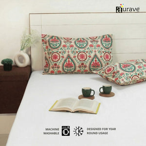 Eczema skin-friendly, zero color fading cotton pillow covers by AURAVE showing precision stitching and traditional pink and teal motifs.