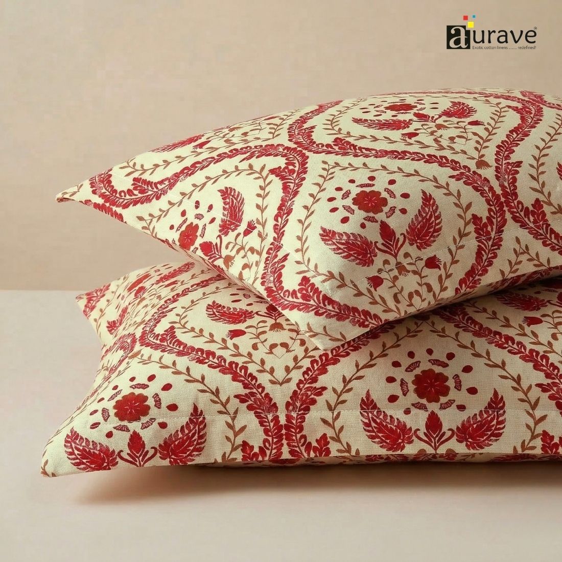 Close-up fabric texture of AURAVE cotton pillow covers featuring an elegant maroon floral damask and block-print style pattern.