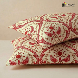 Close-up fabric texture of AURAVE cotton pillow covers featuring an elegant maroon floral damask and block-print style pattern.