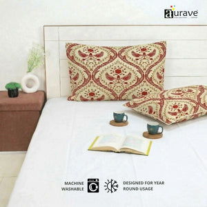 Eczema skin-friendly and fade-resistant cotton pillow covers by AURAVE, featuring a maroon floral pattern and precision stitching.