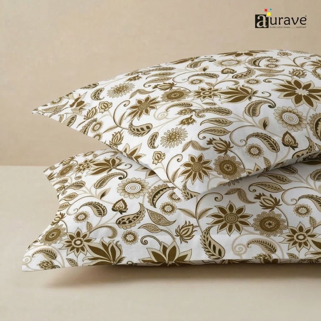 Close-up texture of AURAVE cotton fabric featuring an elegant brown floral and paisley pattern for pillow covers.