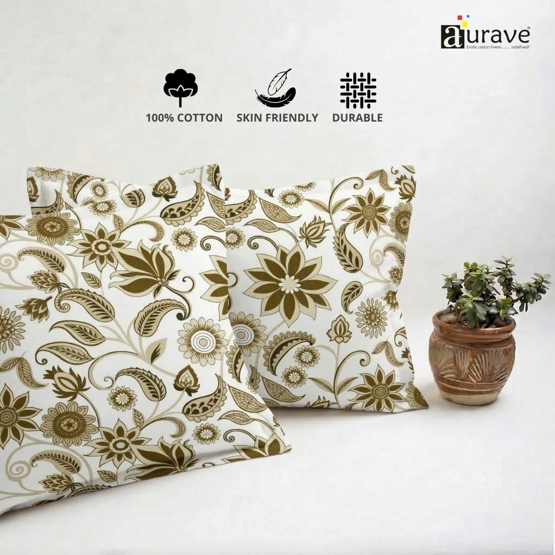 Neatly stacked AURAVE cotton pillow covers showcasing a beautiful earthy brown floral and paisley motif.