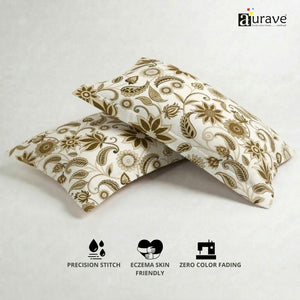 100% cotton, skin-friendly, and durable AURAVE pillow covers with a brown floral print, displayed next to a small potted plant.