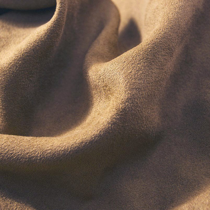 Close-up of brown fabric with a textured surface