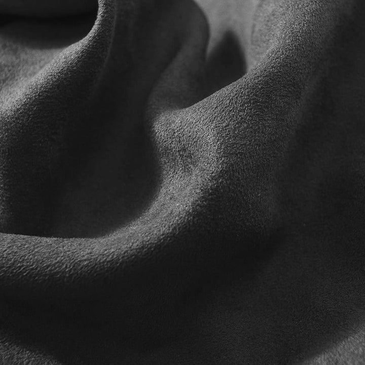 Close-up of dark gray fabric with a textured surface
