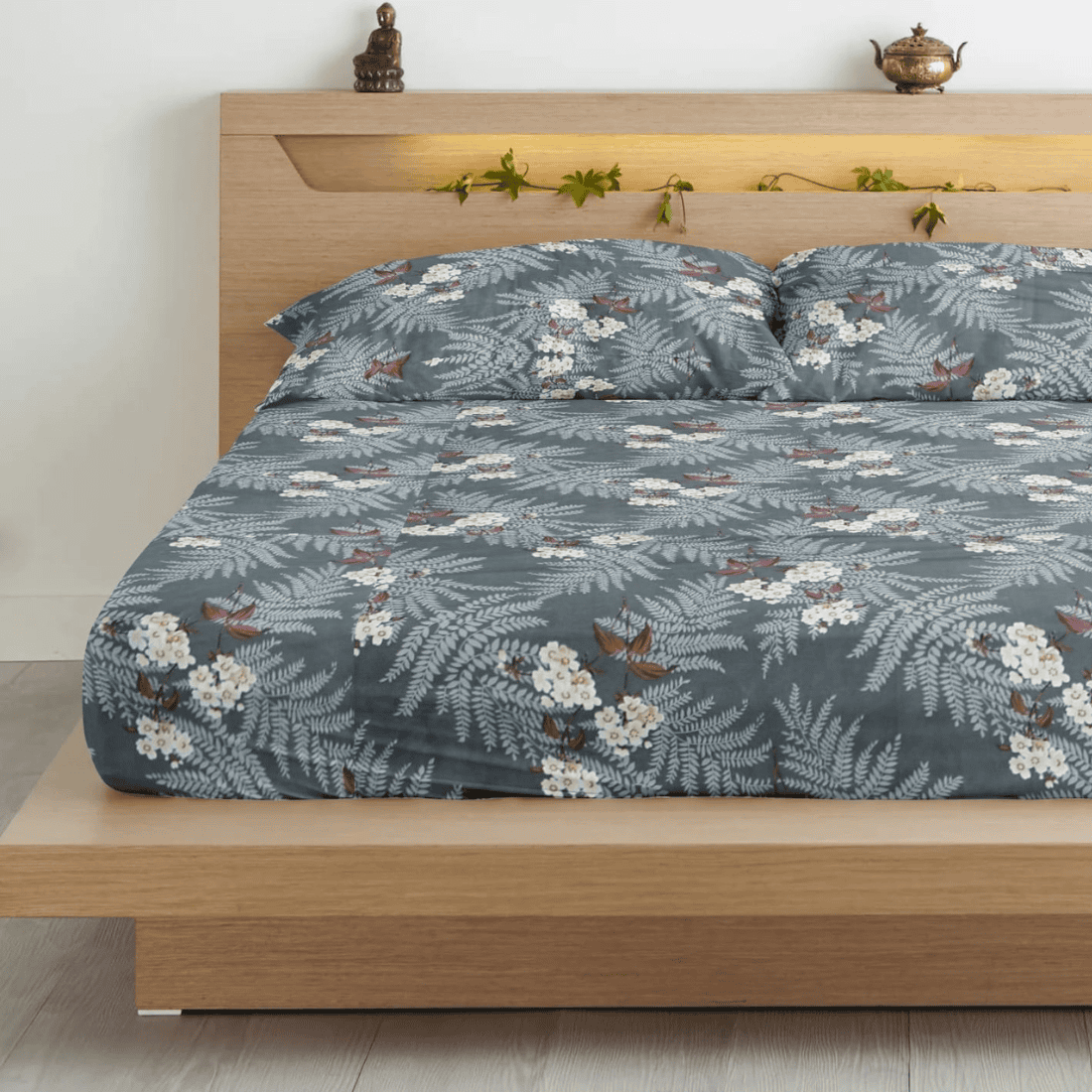 Super king size cotton bedsheet with grey floral print and matching pillow covers on wooden bed.