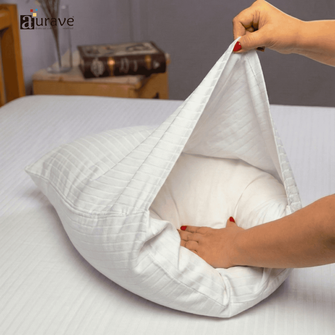 Person opening a white pillow 